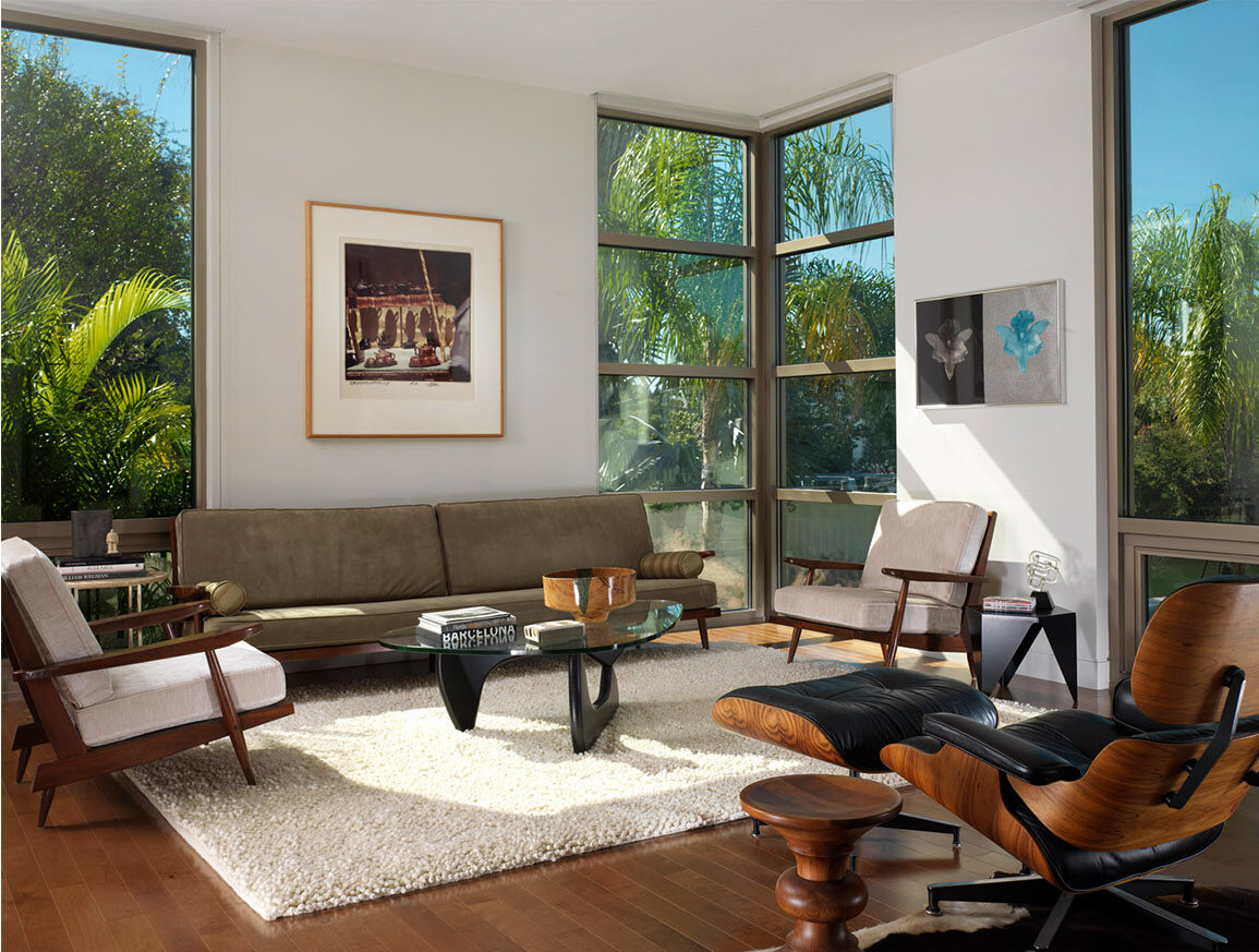 Interior shot of a modern living room with a mid century style and neutral colors