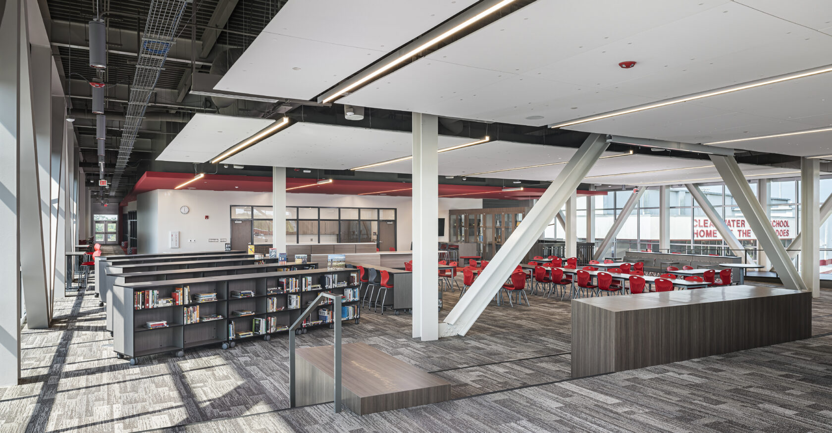 Clearwater High School Library Renovation angled perspective photo. Featuring tables in library