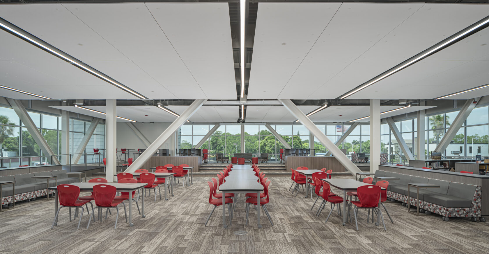Clearwater High School Library Renovation one point perspective photo. Featuring tables in library